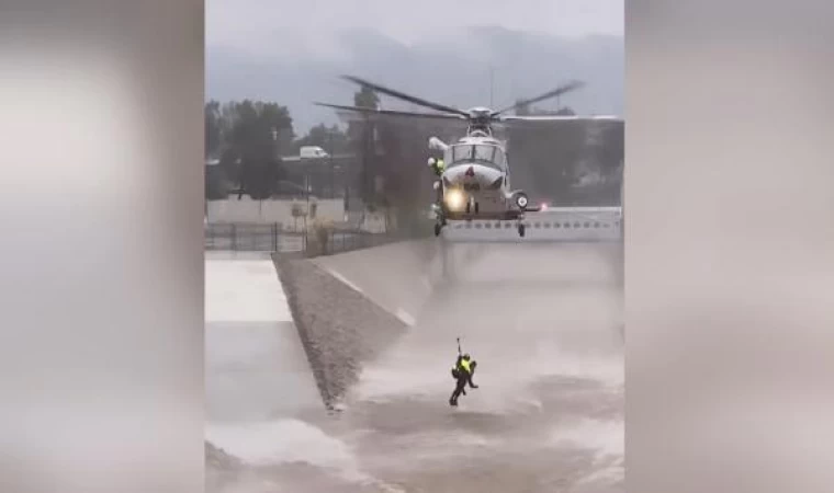 Köpeğinin peşinden kanala atlayan adam helikopterle kurtarıldı