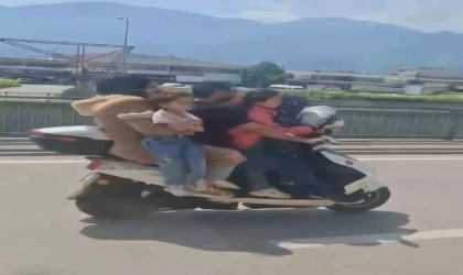 Bursa’da motosiklete 5 kişi binen aile yürekleri ağza getirdi